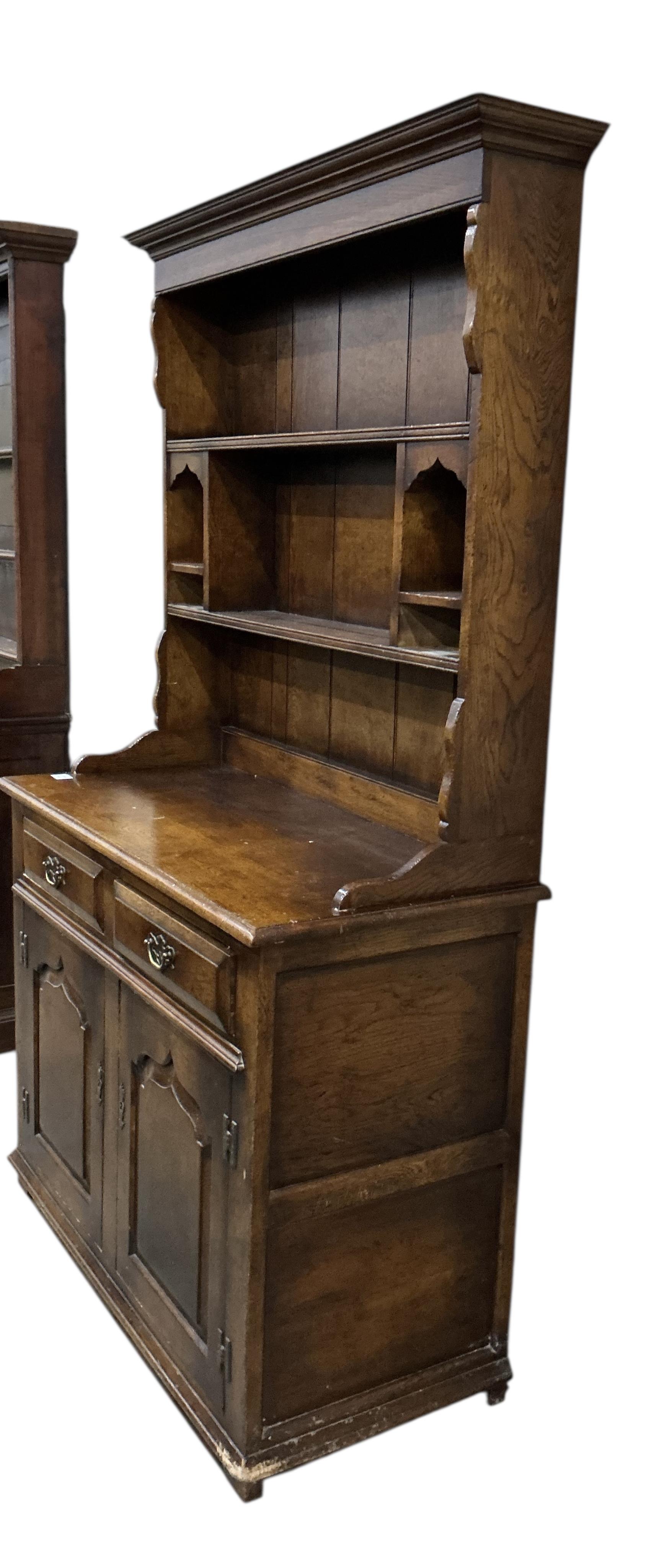 A small 18th century style oak dresser with boarded rack, width 105cm, depth 49cm, height 183cm